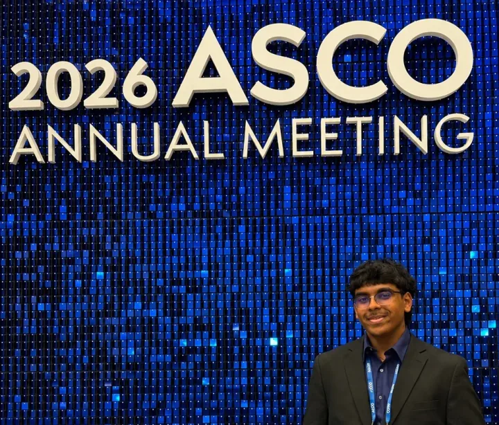 Me in front of the illuminated 2026 ASCO Annual Meeting backdrop