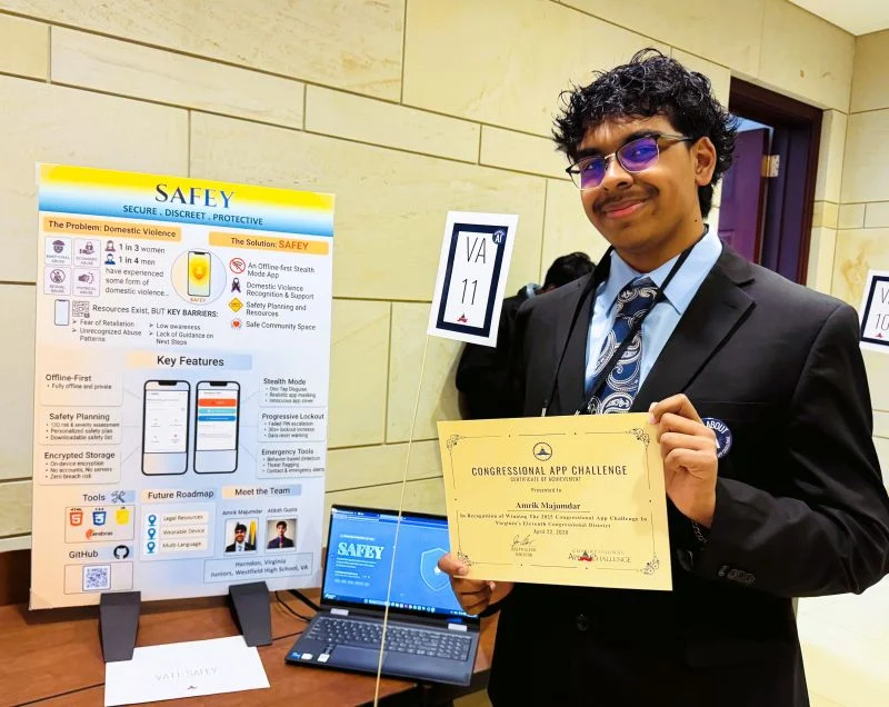 Me holding the Congressional App Challenge certificate beside the SAFEY poster and a laptop showing SAFEY